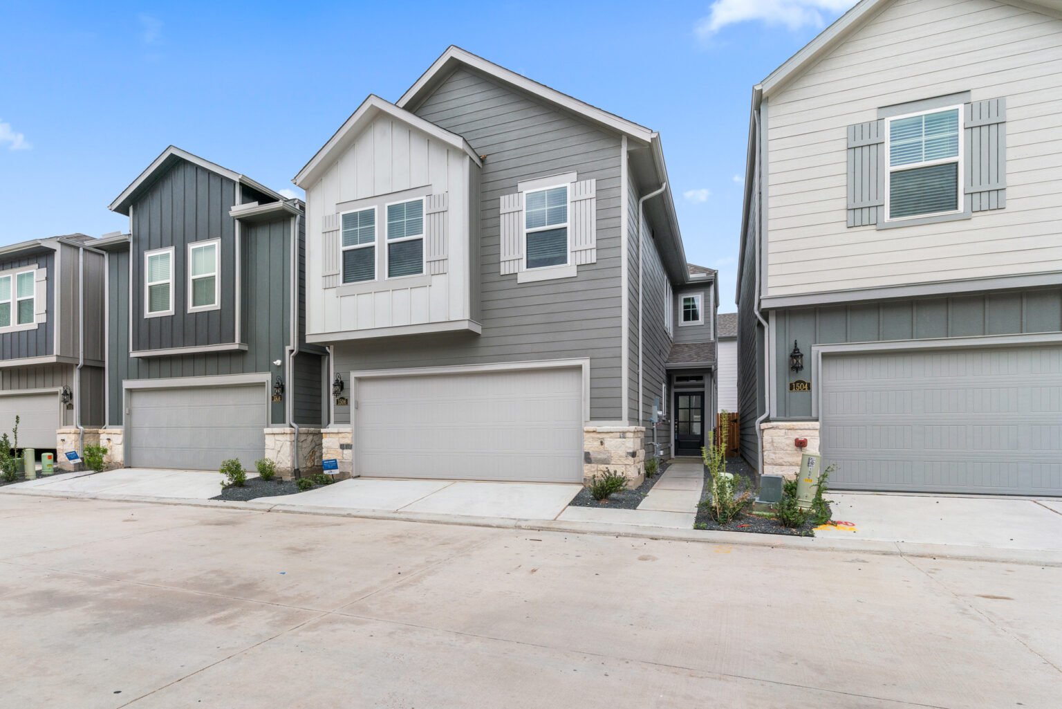 Stunning front view of a modern home captured by Houston Real Estate Photography - Chivalans Photography, showcasing the beautiful exterior and landscaping.