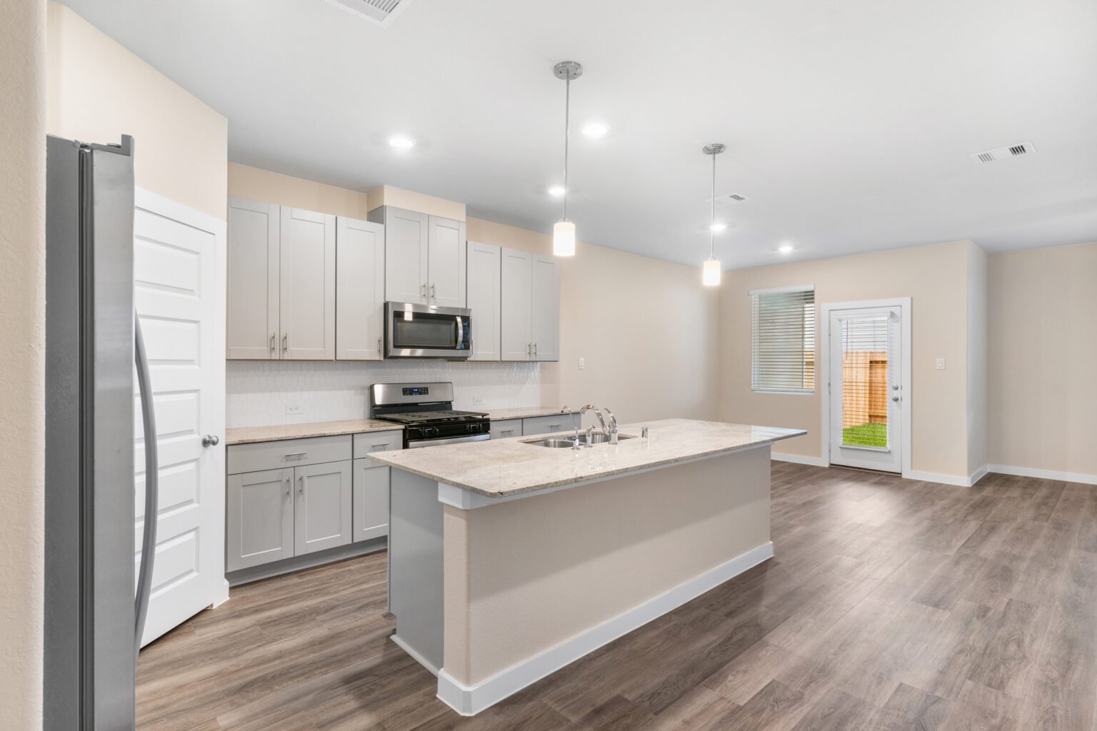 Sleek and contemporary kitchen with high-end appliances, beautifully captured by Chivalans Photography, showcasing the modern design and functionality.