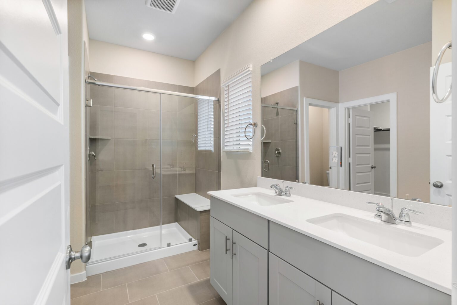 Modern bathroom with sleek fixtures and a stylish design, expertly photographed by Houston Real Estate Photography - Chivalans Photography.