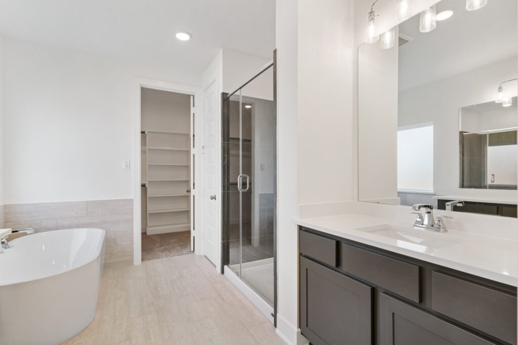 Primary bathroom with freestanding tub and glass shower